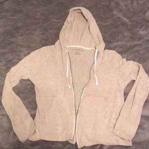 Cream hoodie with zipper.